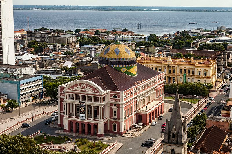 Aerial view of Teatro Amazonas with Manaus and the river beyond