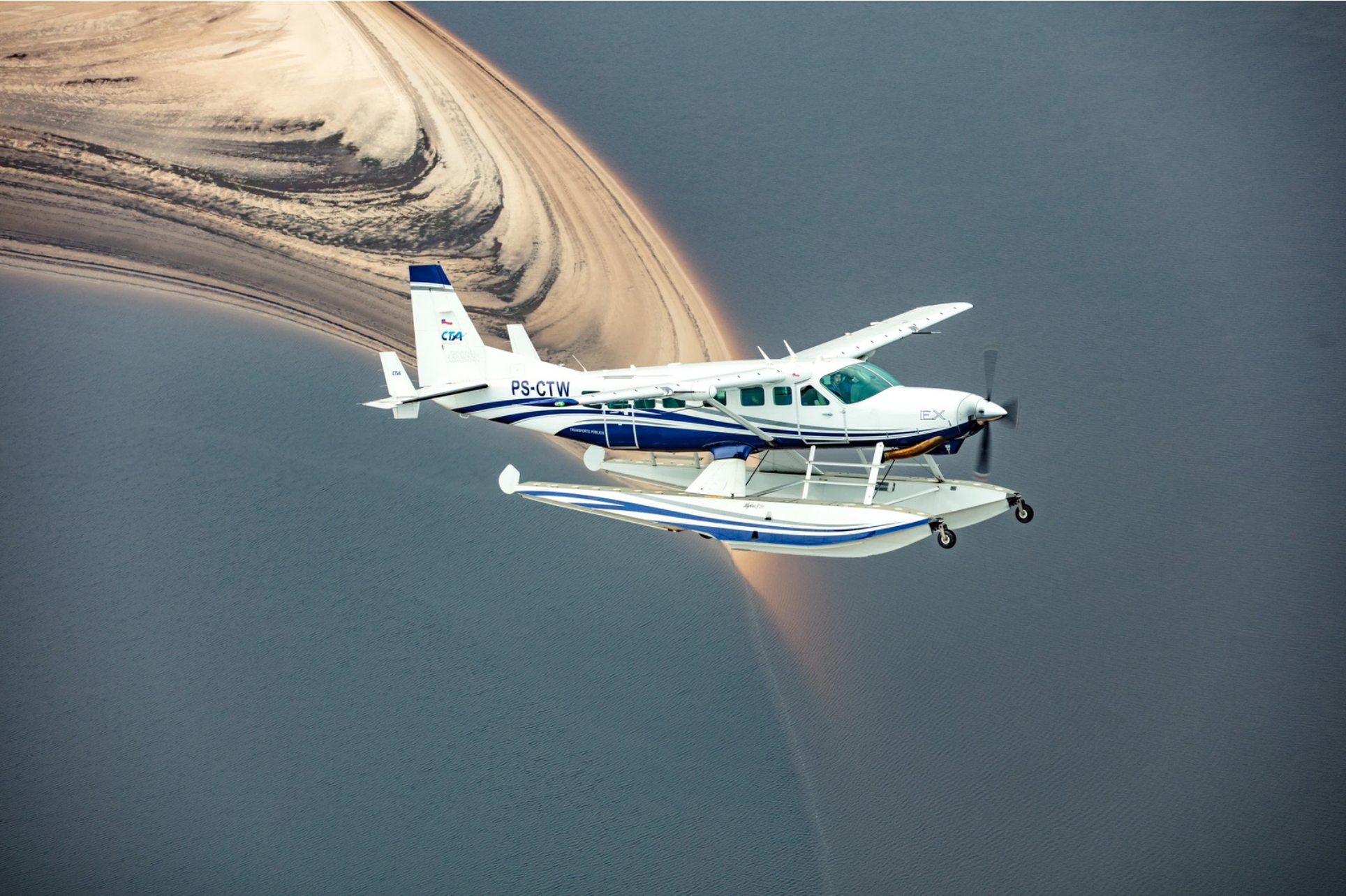 Floatplane flying over an Amazon river landscape